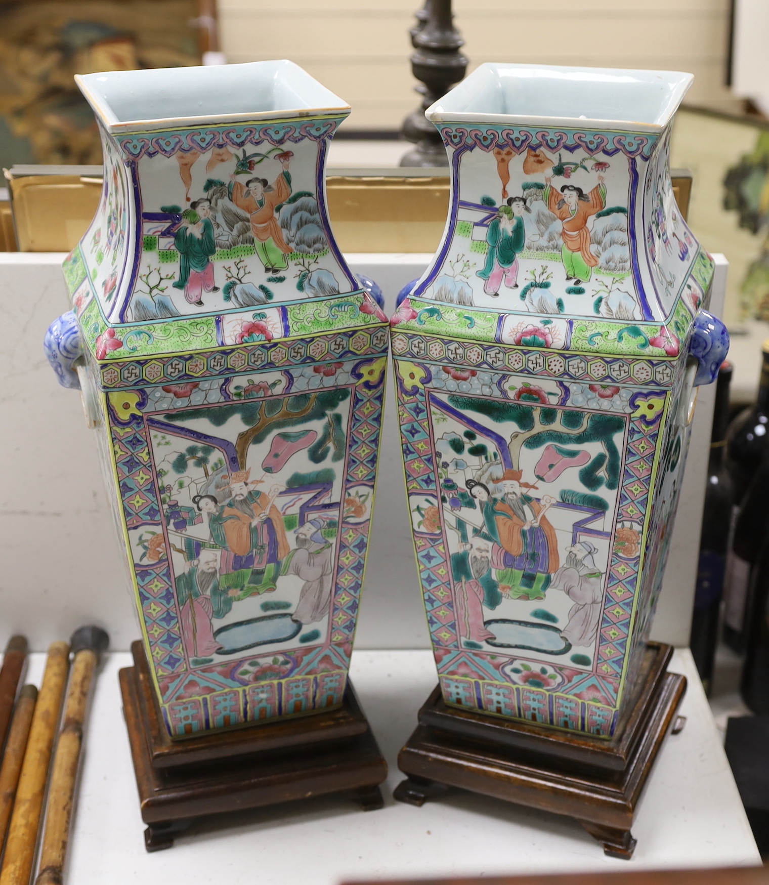 A pair of Chinese famille rose vases, on stands, 49cm total height